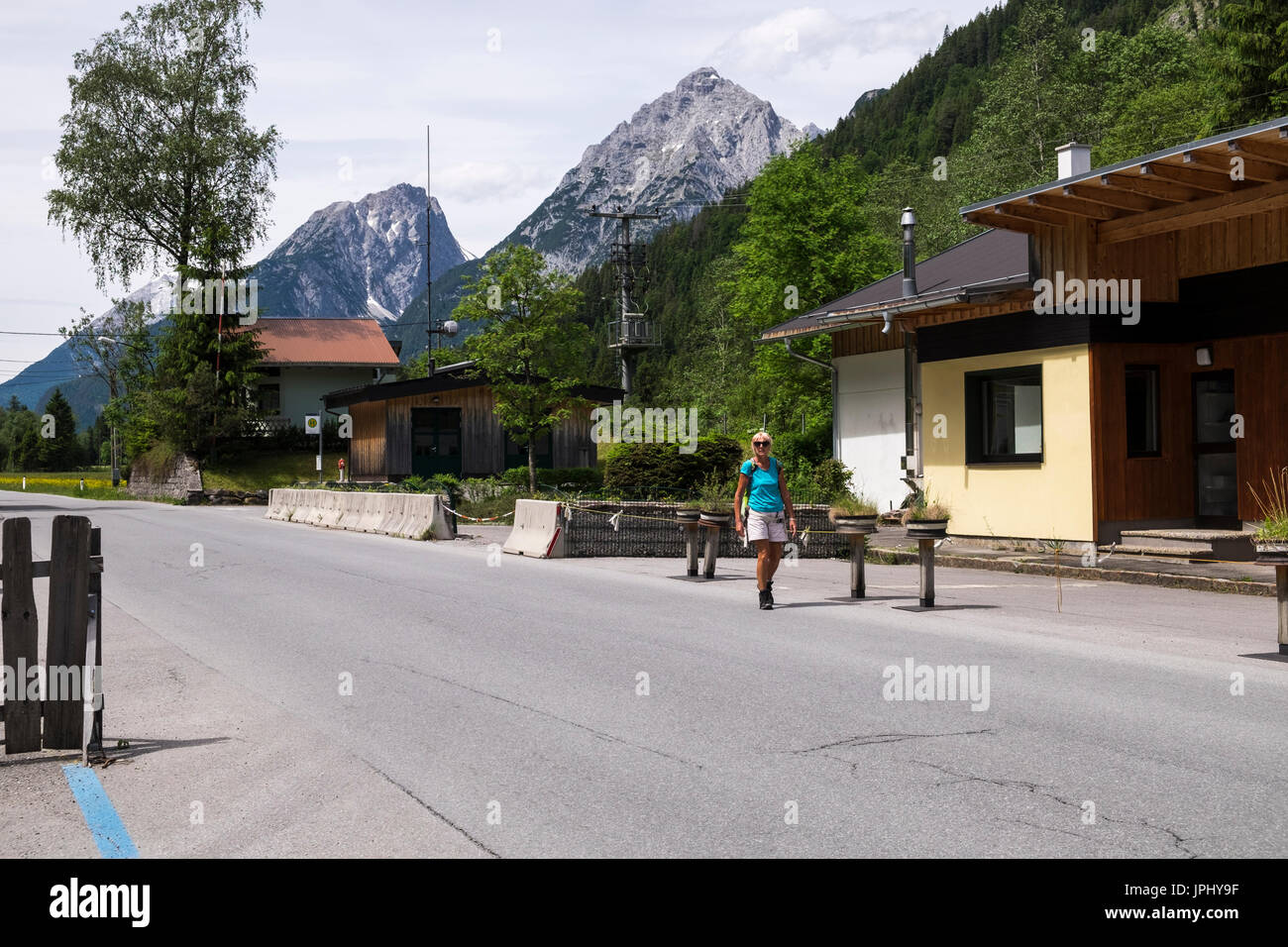 Crossing the border from Austria to Germany next to the disused border control at Klambrucke, Tyrol, Bavaria, Stock Photo