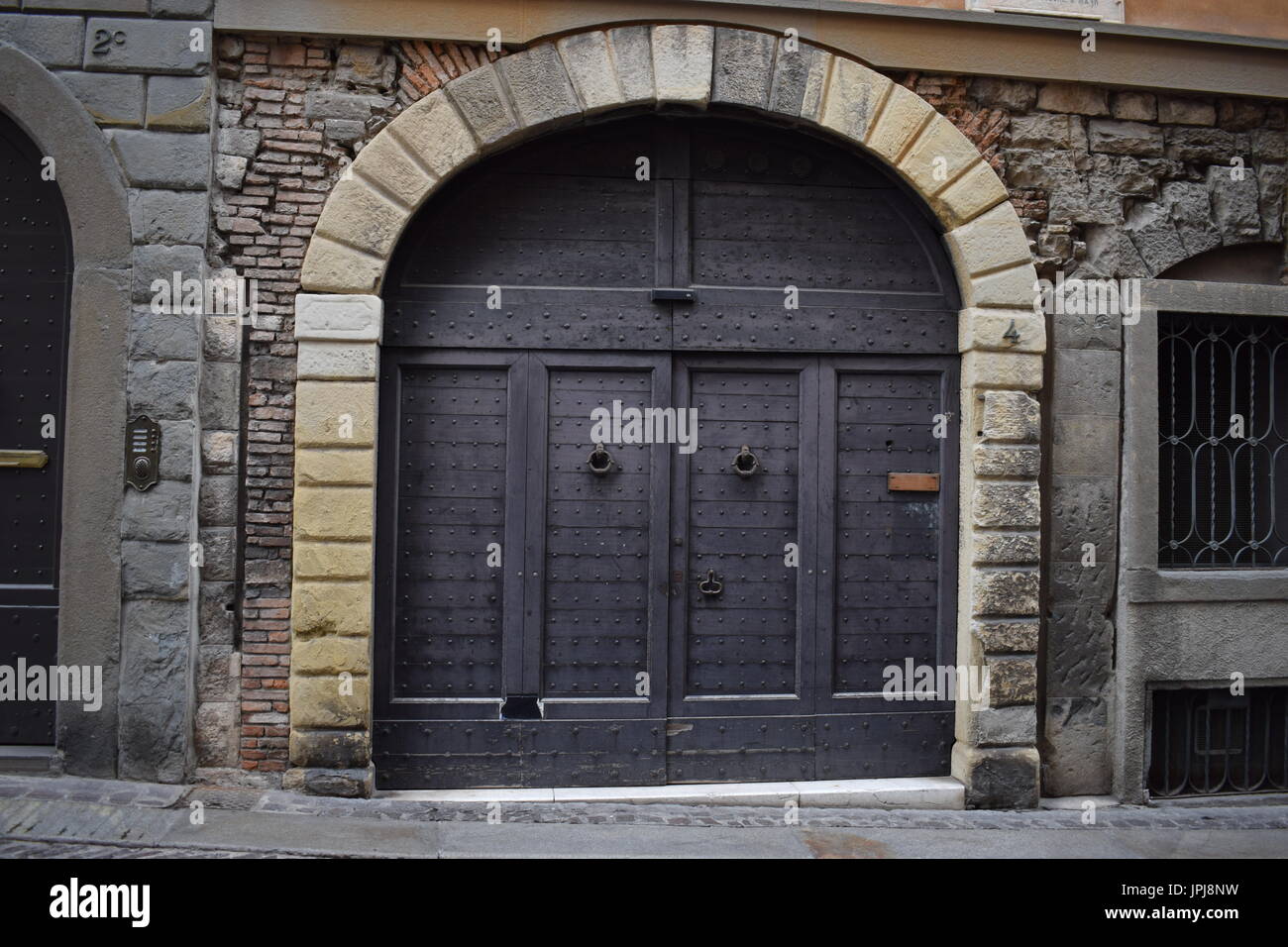 Arc Shaped Entrance Door In Bergamo Italy Stock Photo