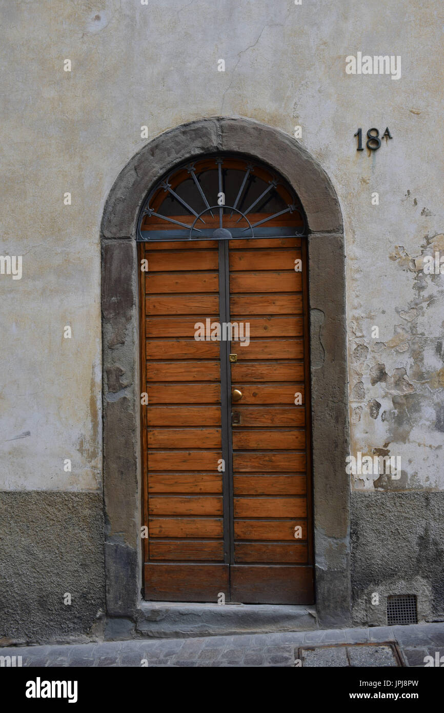 Arc Shaped Building Entrance Door In Bergamo Italy Stock Photo