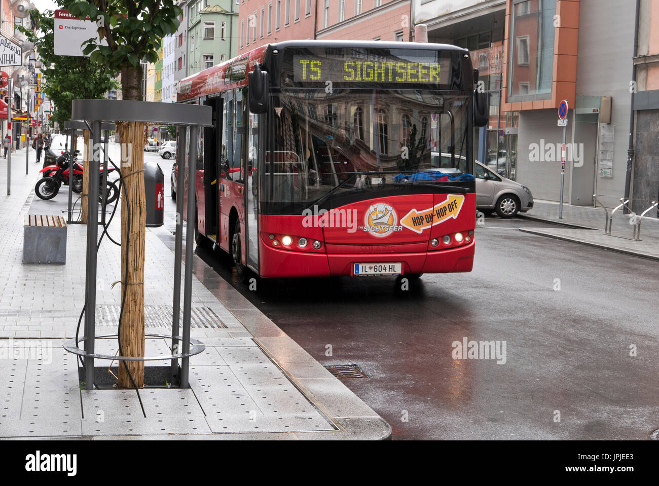 A red Sightseer bus in Innsbruck, Austria Stock Photo