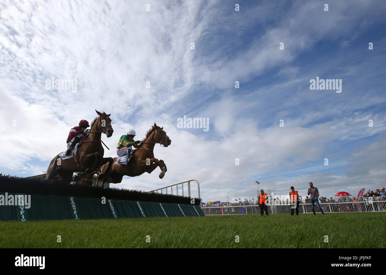 Housesofparliament (right) ridden by Barry Geraghty goes on to win the Colm Quinn BMW Novice Hurdle during day two of the Galway Summer Festival at Galway Racecourse. Stock Photo