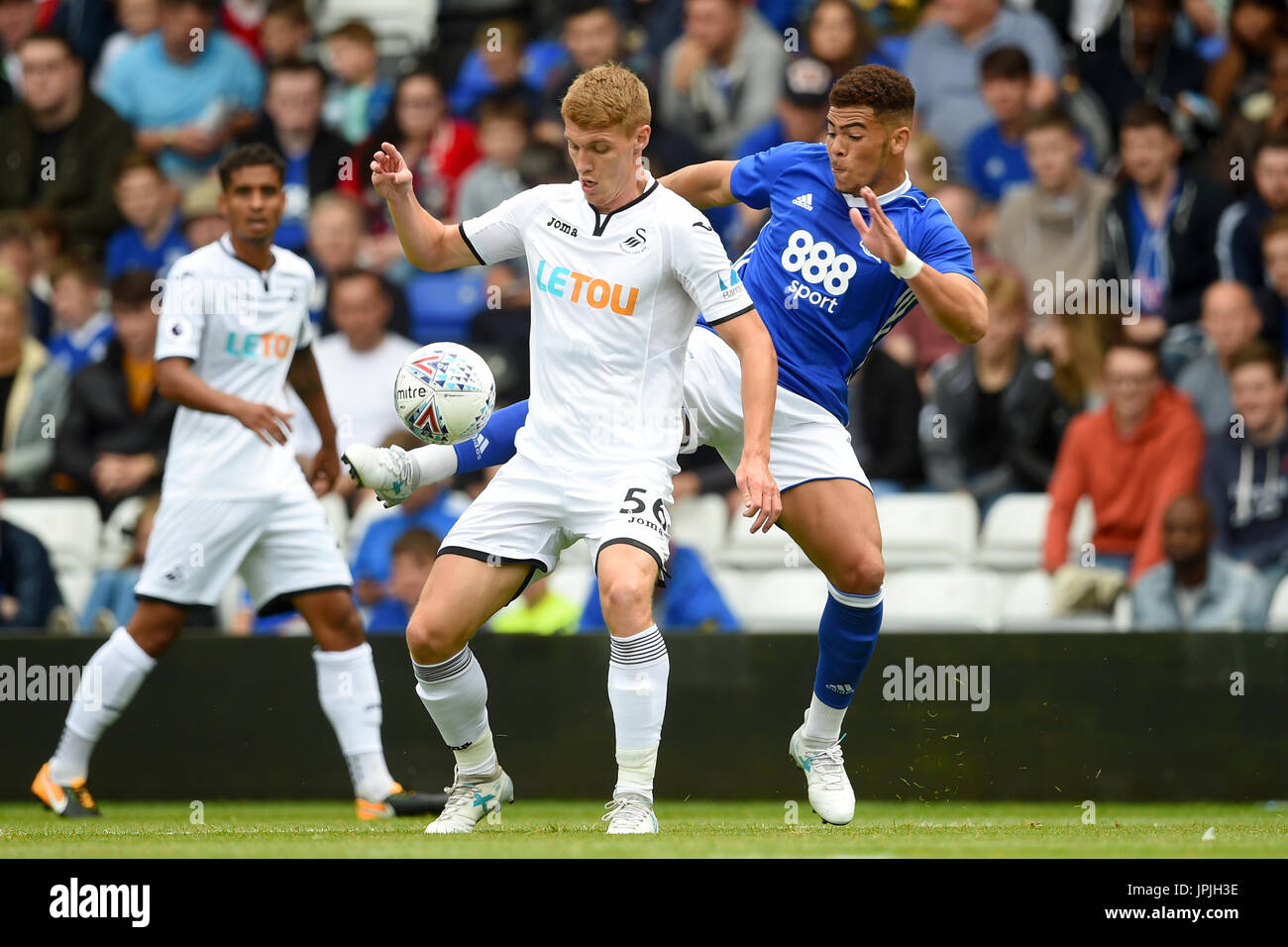Swansea City's Jay Fulton (left) and Birmingham City's Che Adams battle for the ball Stock Photo