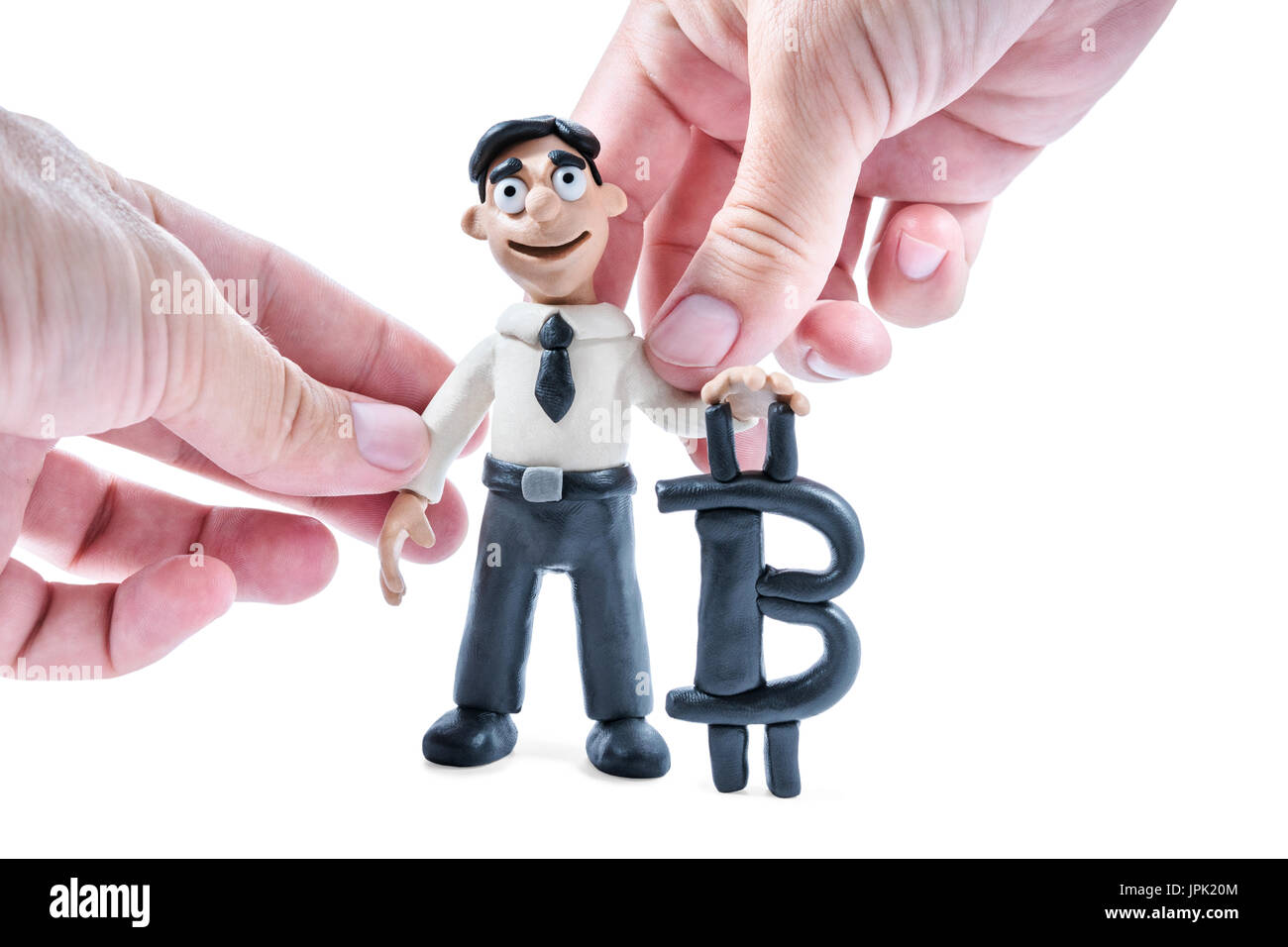 Adult hands molding plasticine businessman with bitcoin isolated on white  background Stock Photo - Alamy