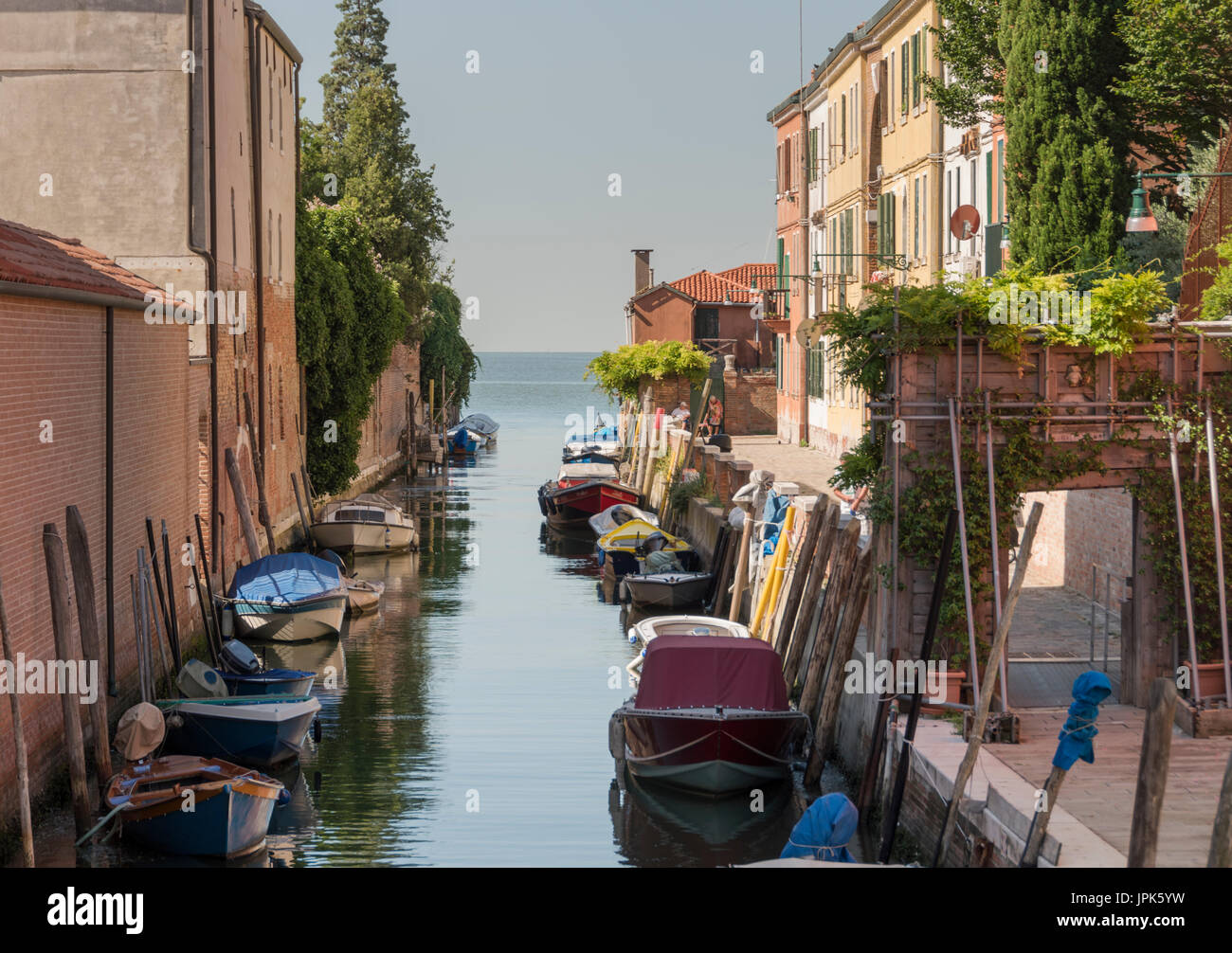 A quiet canal side scene from the less crowded, outlying suburbs of Venice on the Isola della Giudecca. Stock Photo