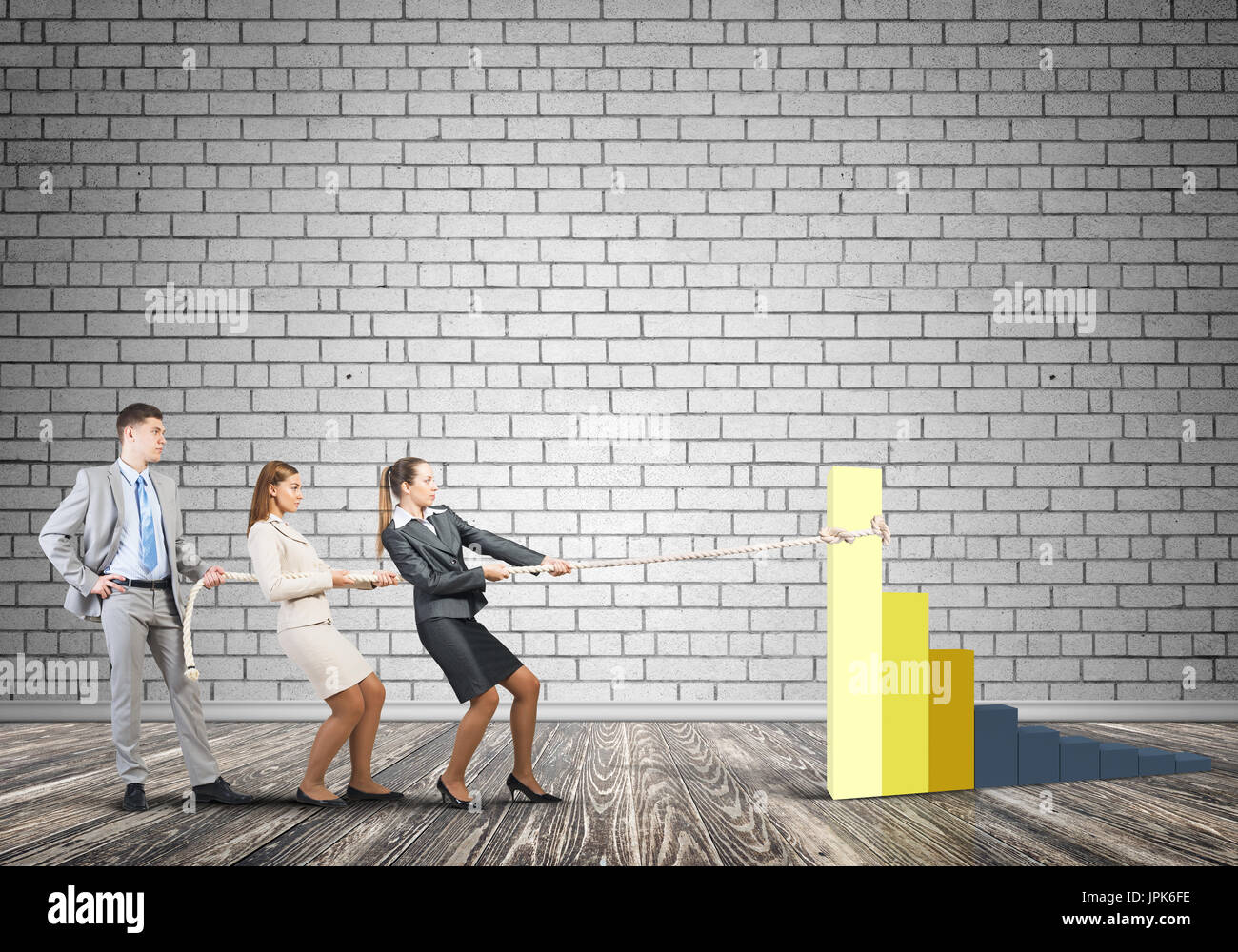 Businessteam working in collaboration pulling graph with rope as symbol ...