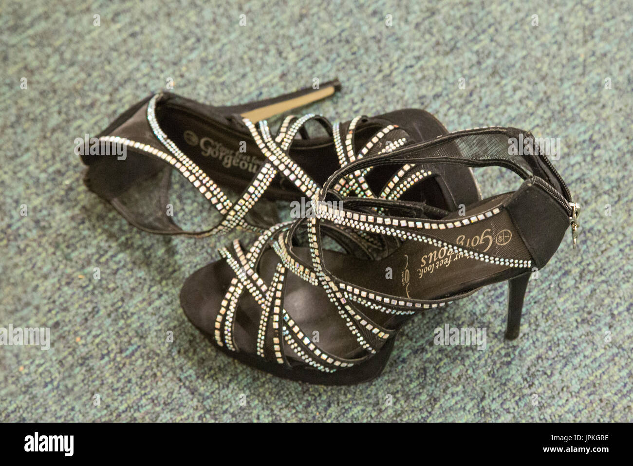 Beautiful sandal shoes decorated with sequins and beads. High heels to go with their ballroom gowns for the High School Prom. Stock Photo