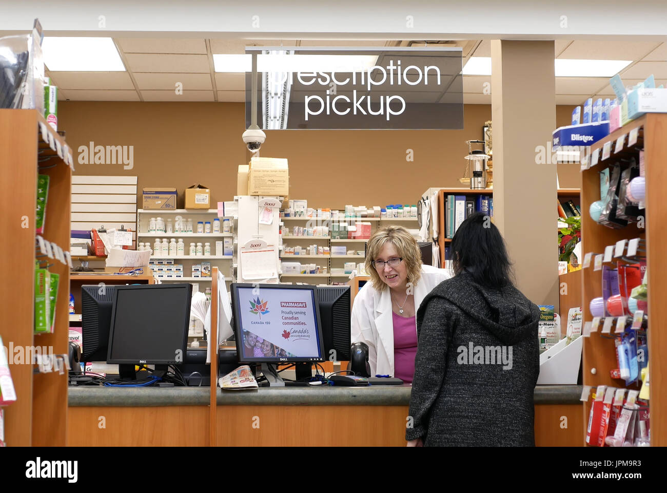 Port Coquitlam, BC, Canada - April 11, 2017 : People picking up her prescription medicine at pharmacy section in Port Coquitlam BC Canada Stock Photo