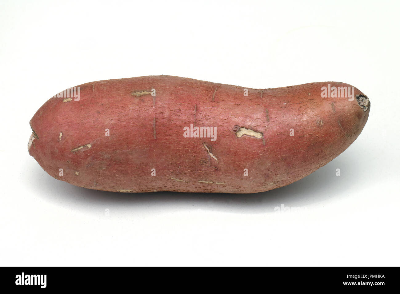 Red skin raw sweet potato on white background Stock Photo