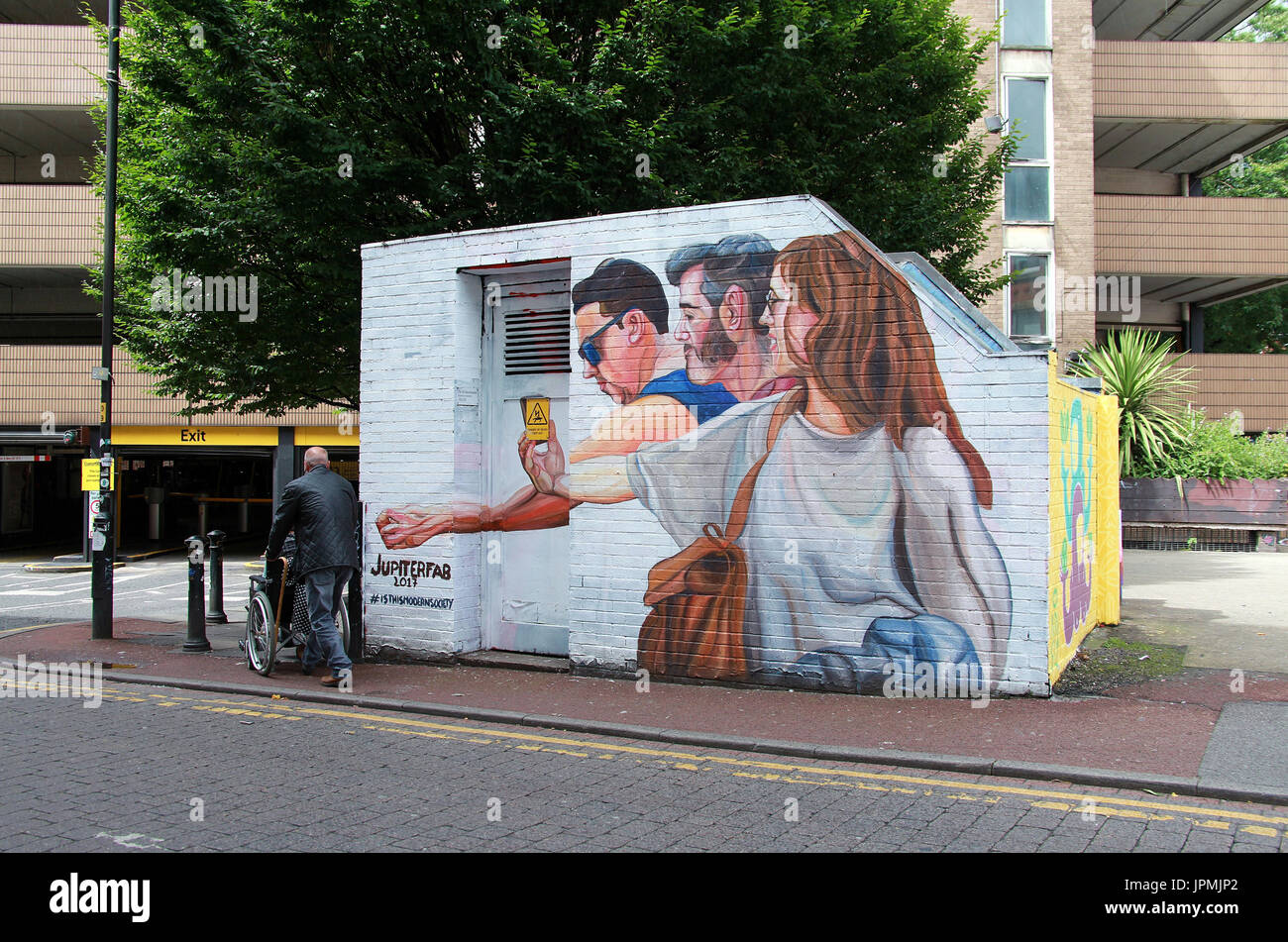 Manchester street mural called Is This Modern Society by Italian artist Jupiterfab Stock Photo