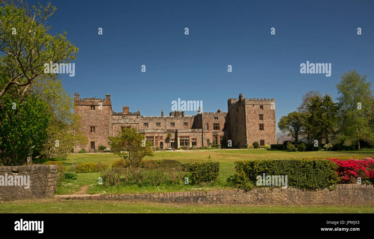 Panoramic view of historic Muncaster castle, stately home under blue sky in Cumbria, England Stock Photo