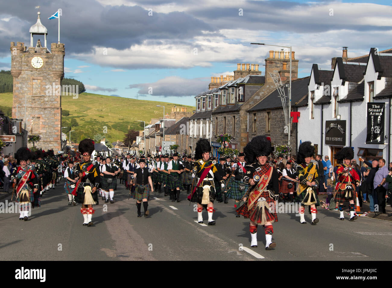 Dufftown, Scotland - Jul 31, 2017: Massed pipe bands display 'beating the retreat' in the town after the 2017 Highland Games in Dufftown, Scotland. Stock Photo