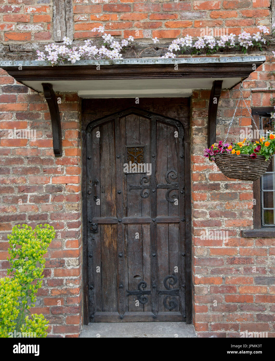 Dark Brown Wooden Door Of Historic Cottage With Decorative
