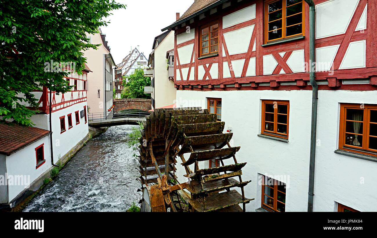 Buildings and old mill wheel along river Große Blau in fishermen's quarter  in Ulm, Baden-Wuerttemberg, Germany Stock Photo