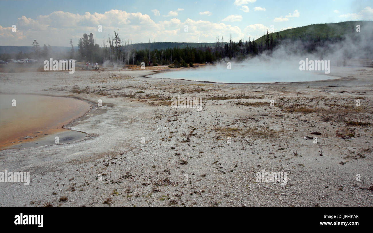 Rainbow Pool hot spring and Sunset Lake geyser in Black Sand Basin in Yellowstone National Park in Wyoming United States Stock Photo