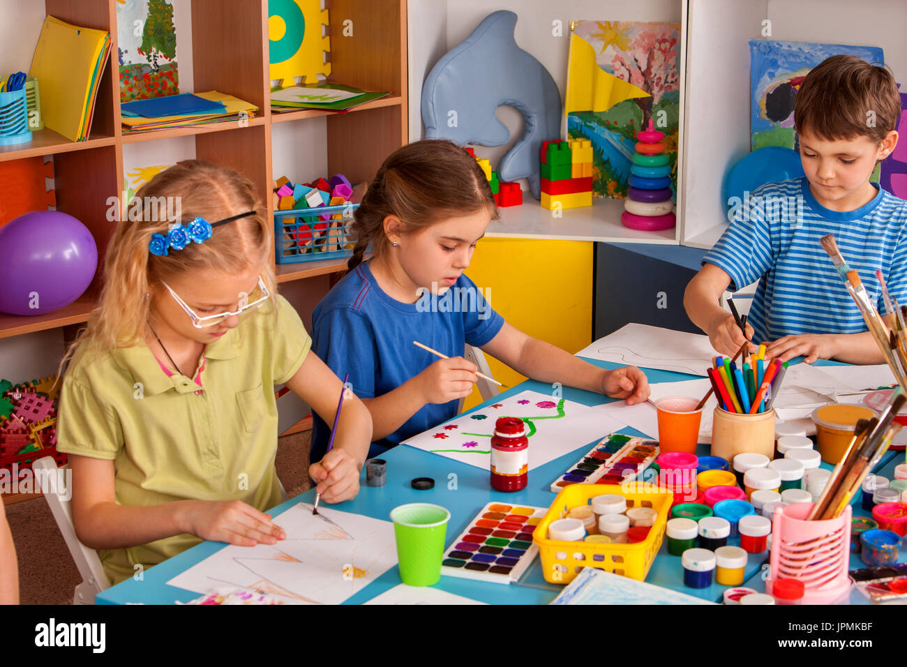 Small students girl painting in art school class Stock Photo - Alamy