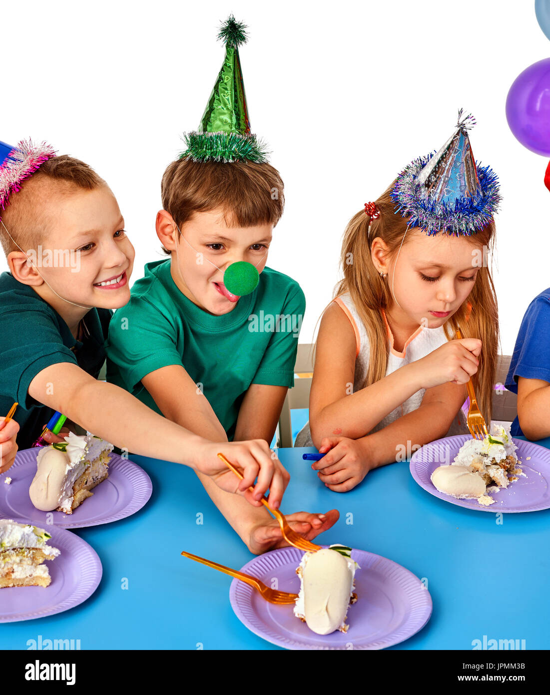 Birthday children celebrate party and eating cake on plate together