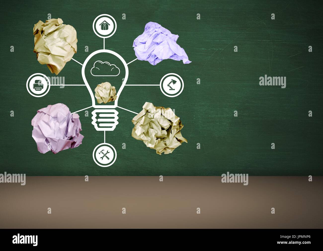 Digital composite of light bulb with crumpled paper balls in front of ...