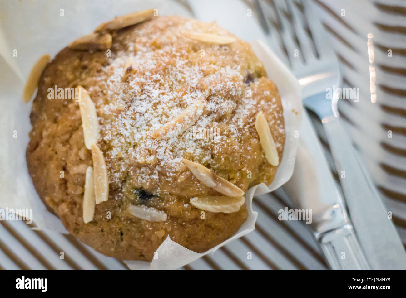 Blueberry muffin serving with knife and fork, stock photo Stock Photo