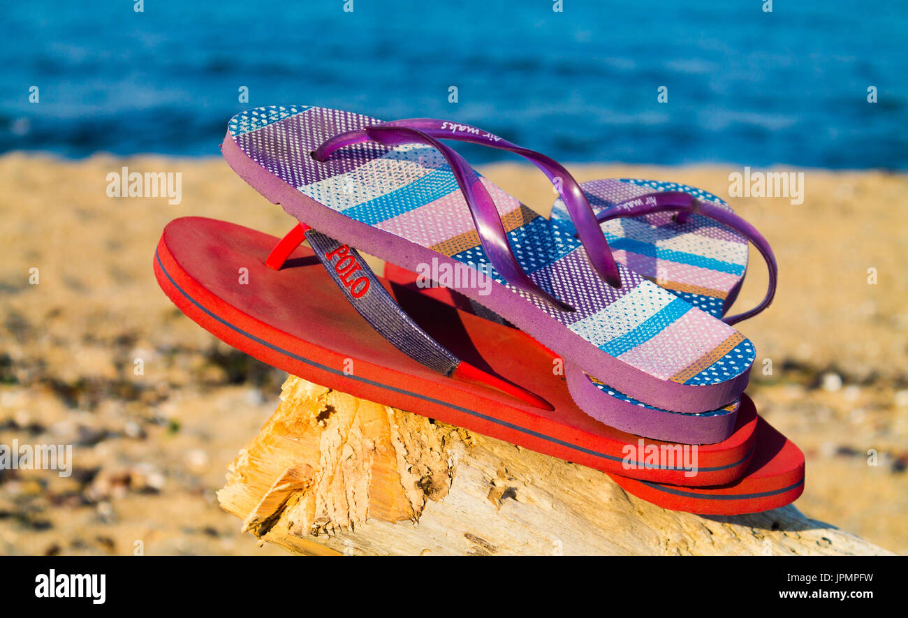 Flip-flops on a sandy beach Stock Photo - Alamy
