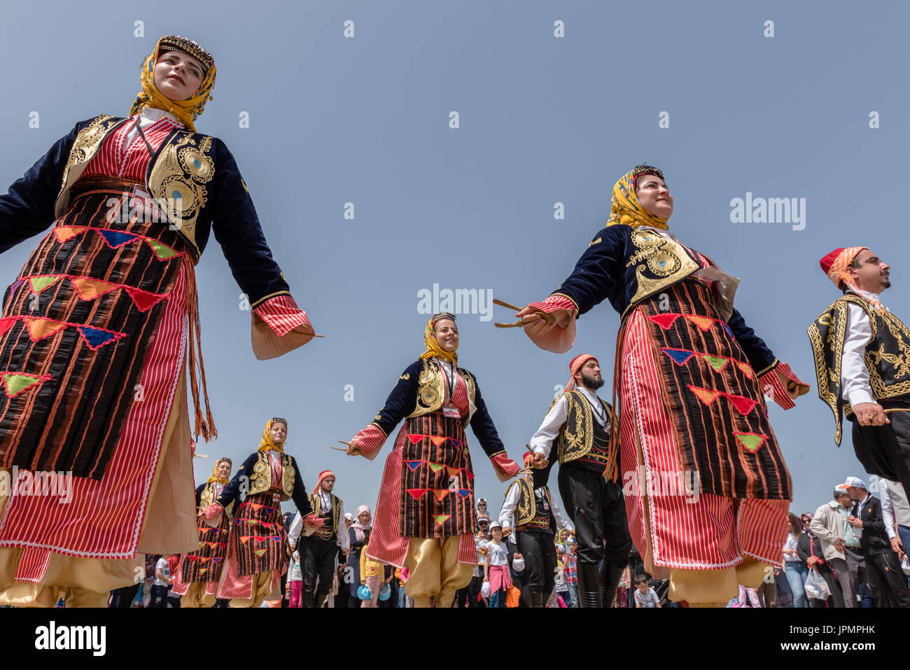 Unidentified people playing traditional folklore with their ethnic clothes at a show.It is popular in Turkey.ISTANBUL, TURKEY, May 13, 2017 Stock Photo