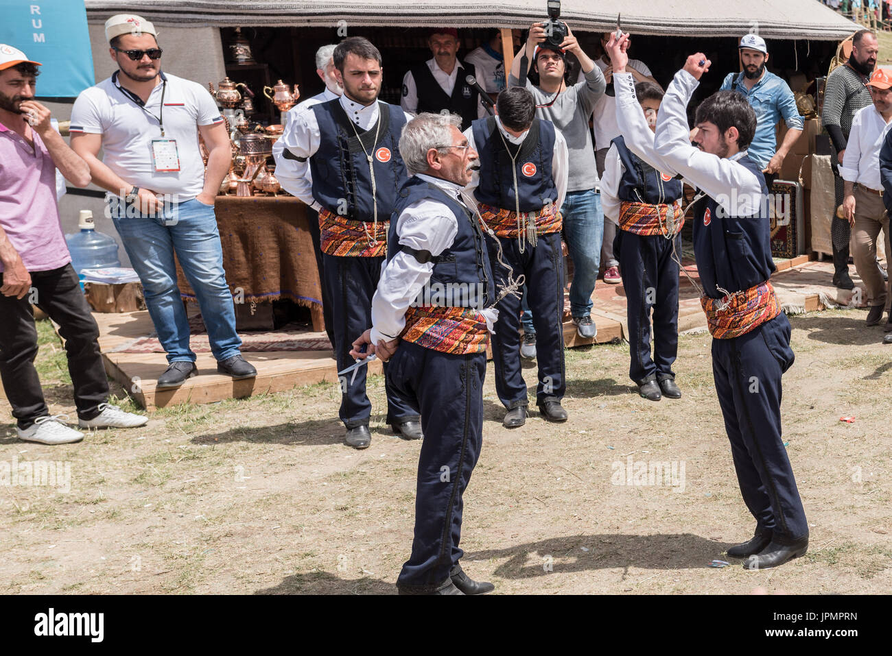 Unidentified people playing traditional folklore with their ethnic clothes at a show.It is popular in Turkey.ISTANBUL, TURKEY, May 13, 2017 Stock Photo