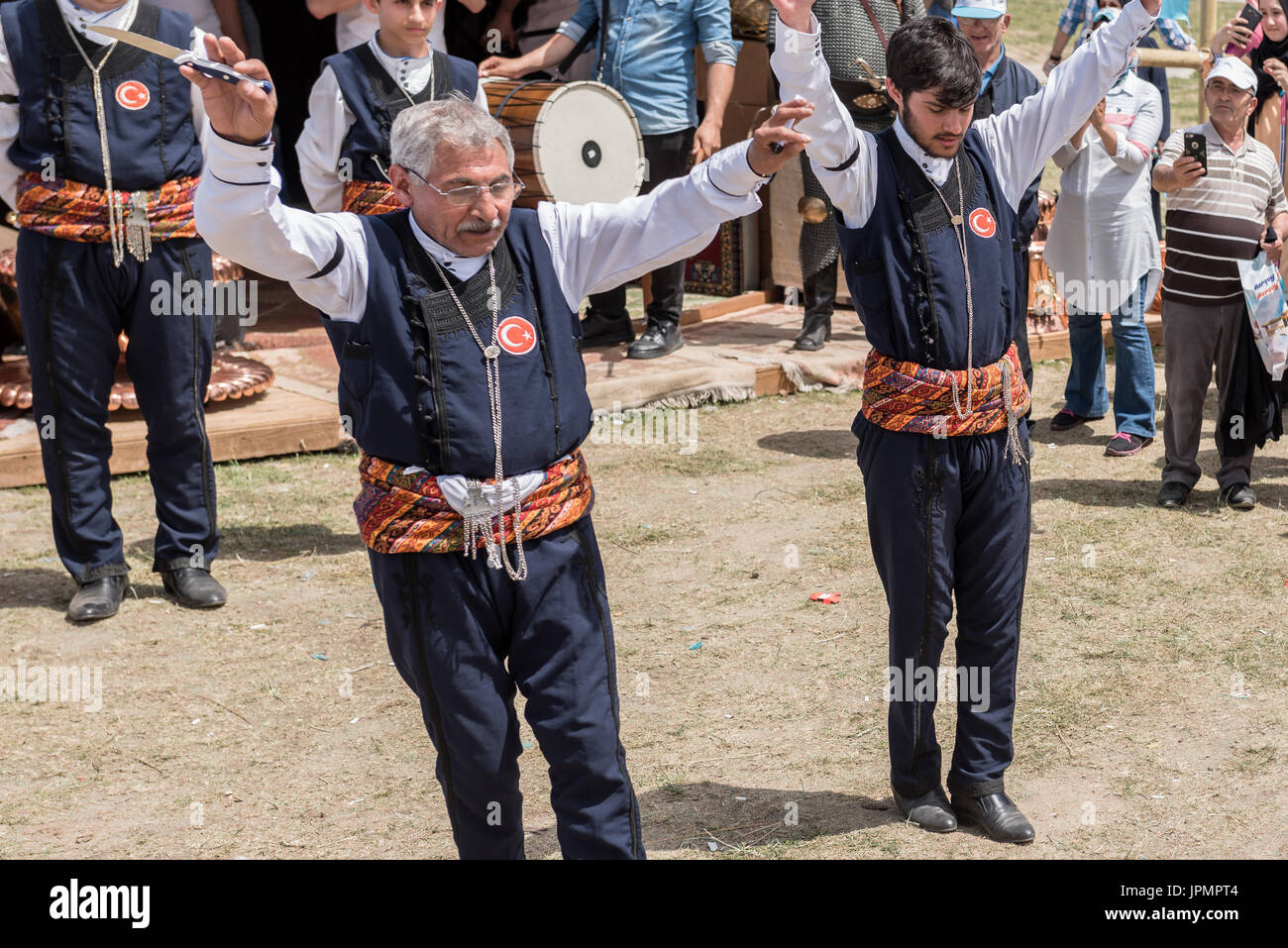 Unidentified people playing traditional folklore with their ethnic clothes at a show.It is popular in Turkey.ISTANBUL, TURKEY, May 13, 2017 Stock Photo