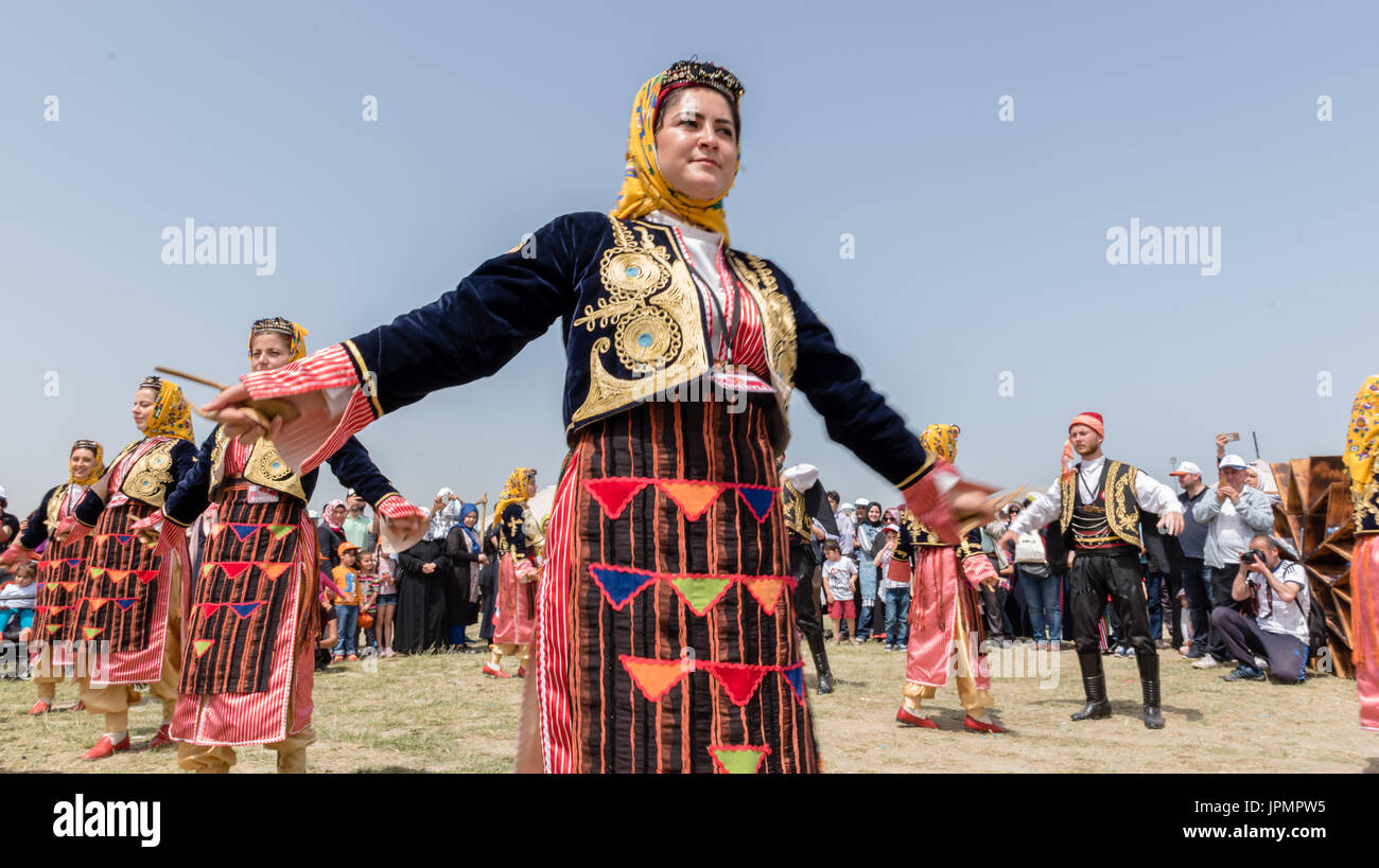Unidentified people playing traditional folklore with their ethnic clothes at a show.It is popular in Turkey.ISTANBUL, TURKEY, May 13, 2017 Stock Photo