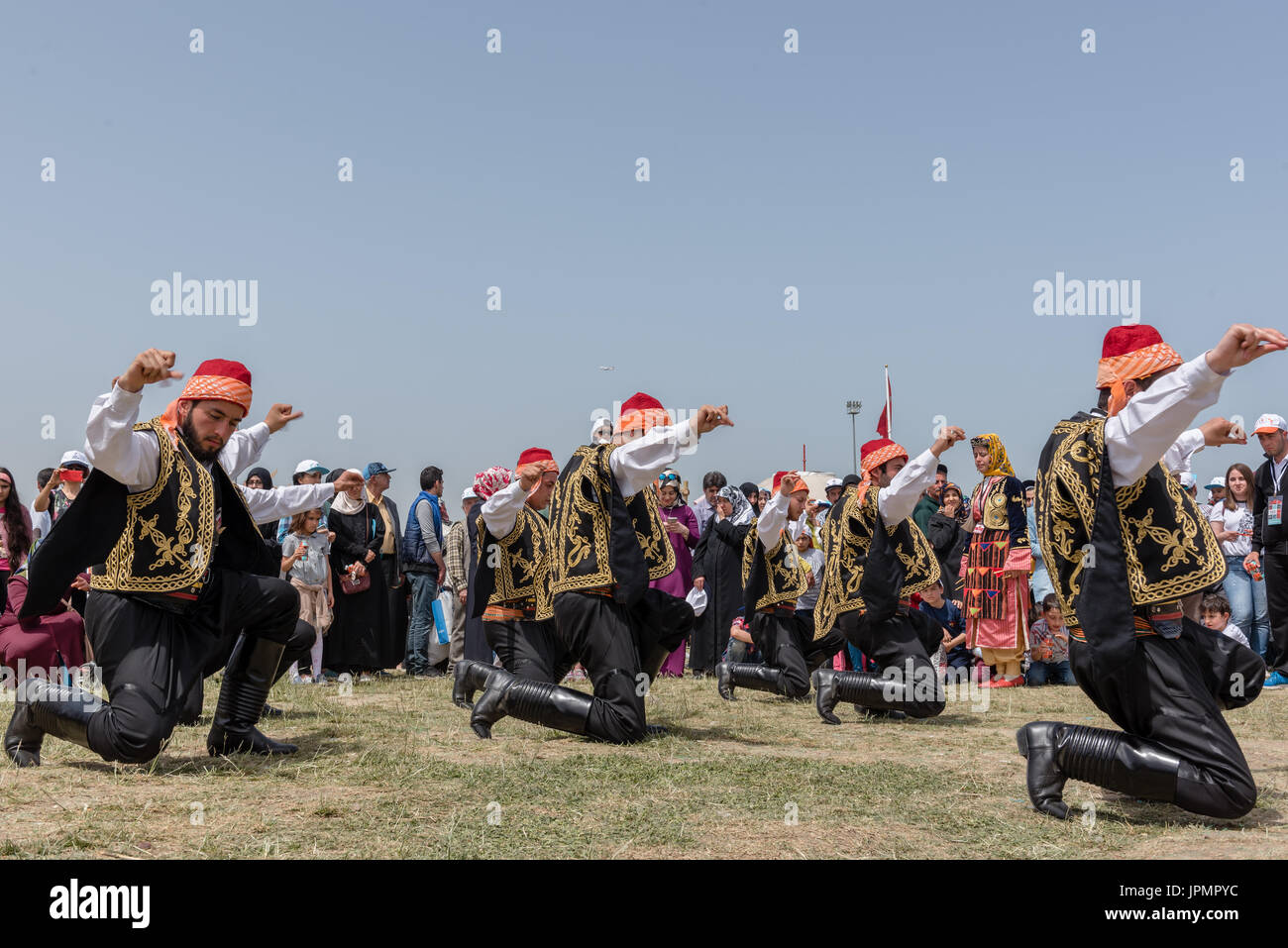 Unidentified people playing traditional folklore with their ethnic clothes at a show.It is popular in Turkey.ISTANBUL, TURKEY, May 13, 2017 Stock Photo