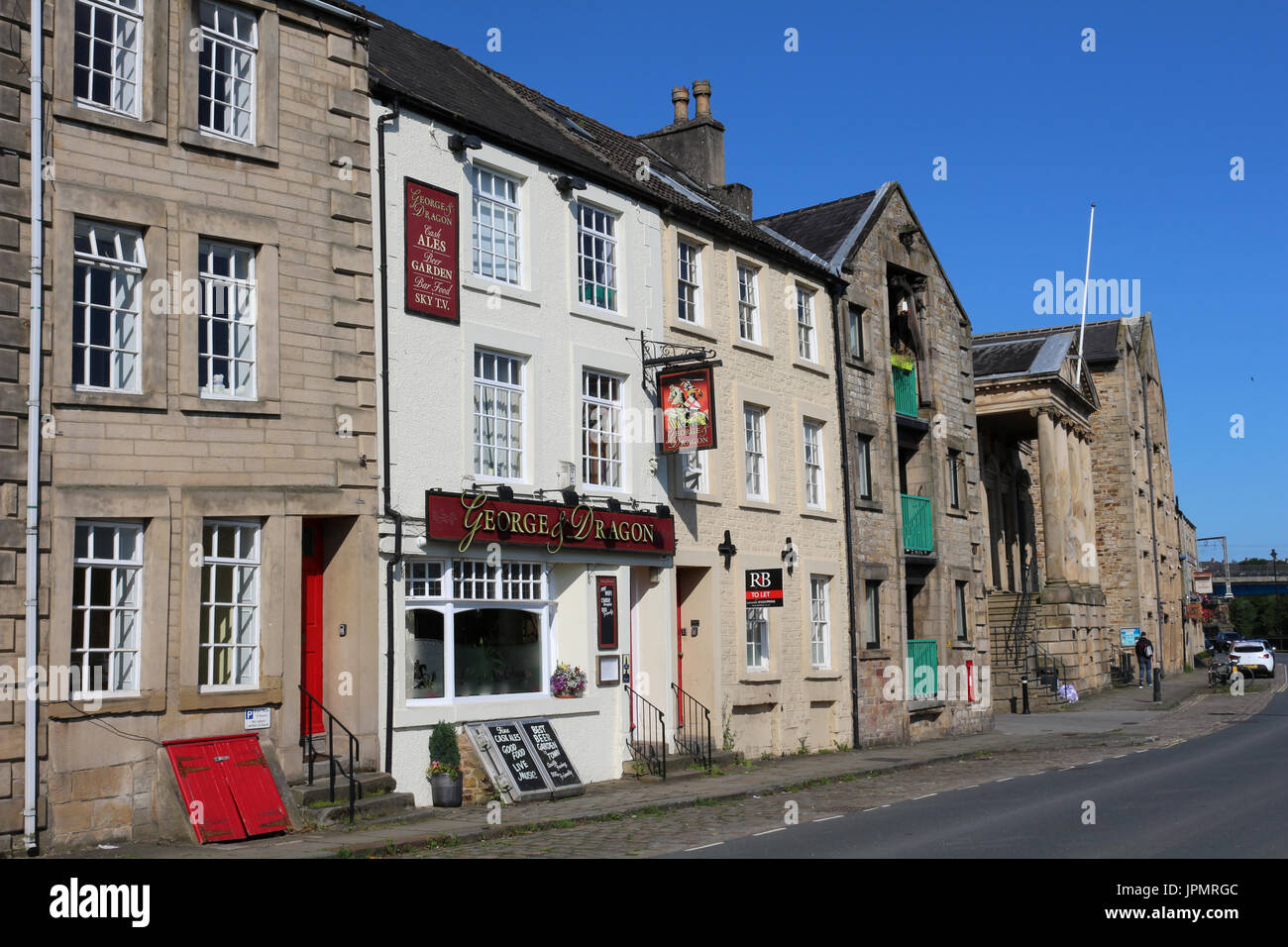 View along St Quay in Lancaster past various buildings