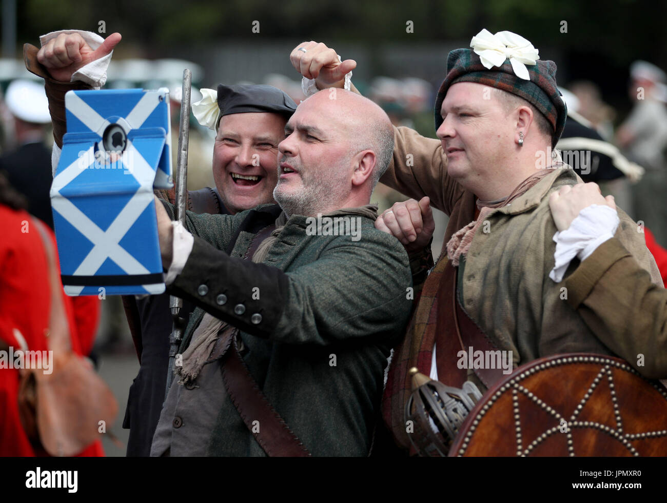 Members of the Jacobite re-enactment group take a selfie during the rehearsal for The Royal Military Edinburgh Tattoo at Redford Barracks, Edinburgh. Stock Photo