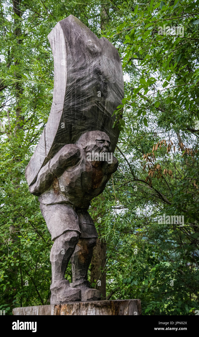 Things Tirolean with a woodland statue of a man carrying a heavy load