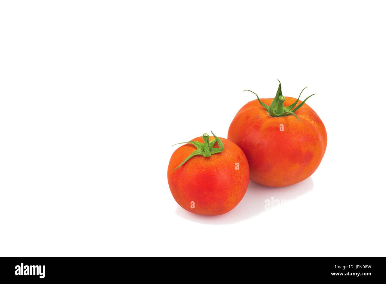 Real organic tomatoes isolated on white background Stock Photo