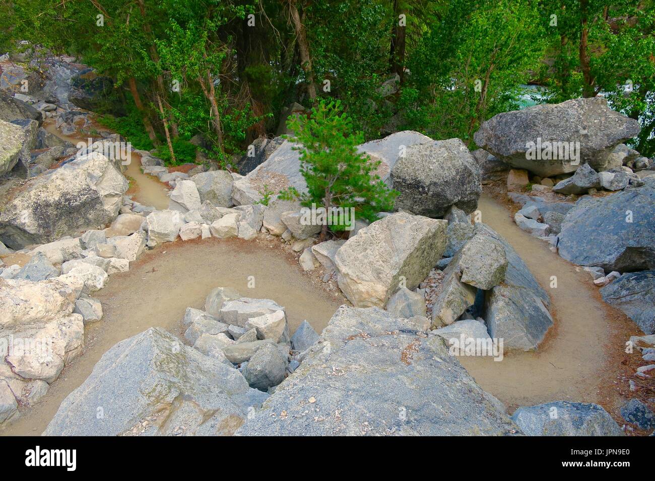 Serpentine path winding through boulders along the King's River, King's Canyon National Park, California, United States Stock Photo