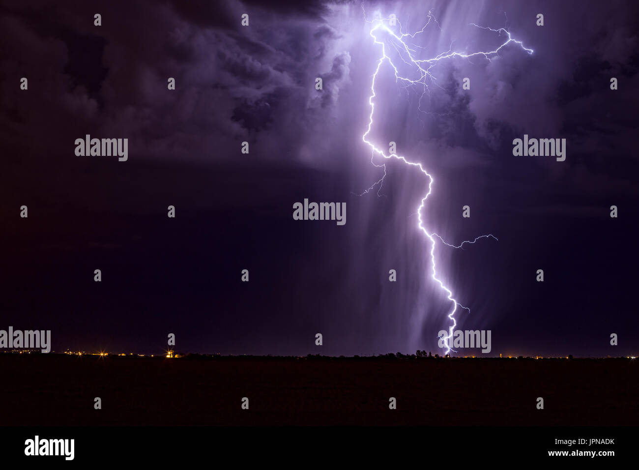 Dramatic lightning storm over a city at night Stock Photo - Alamy