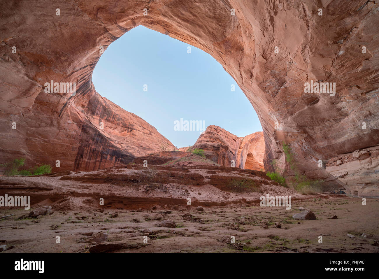 A nature amphitheater can be found in Coyote Gulch where Coyote Creek flows around Jacob Hamblin Arch; Grand Staircase-Escalante National Monument, Ut Stock Photo