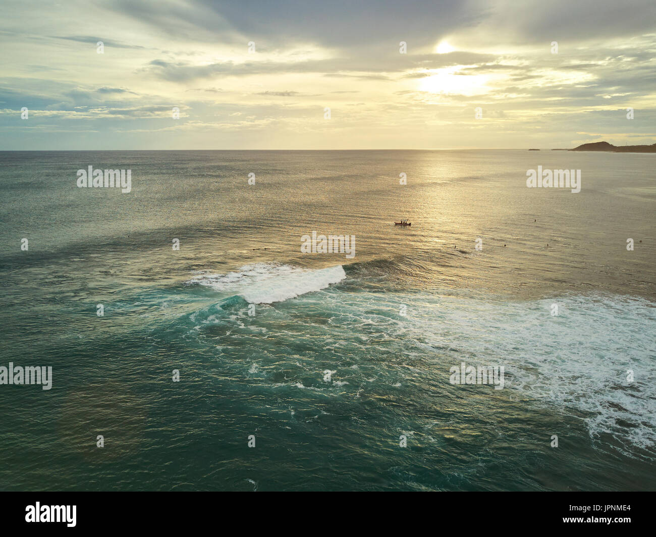 Surf activity on sunset time aerial drone view. Big waves for surfing Stock Photo