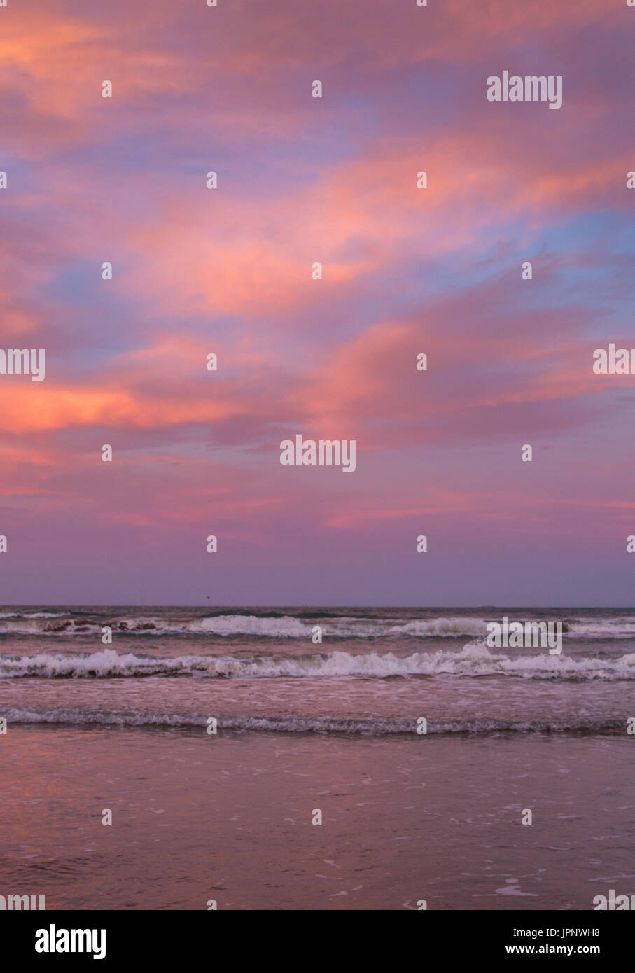 Purple and Pink  Color Clouds During Beach Sunset Stock Photo