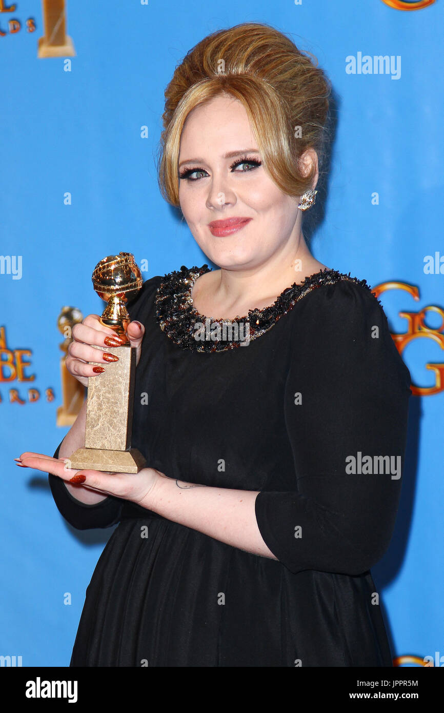 Adele poses in the press room at the 70th Annual Golden Globe Awards ...