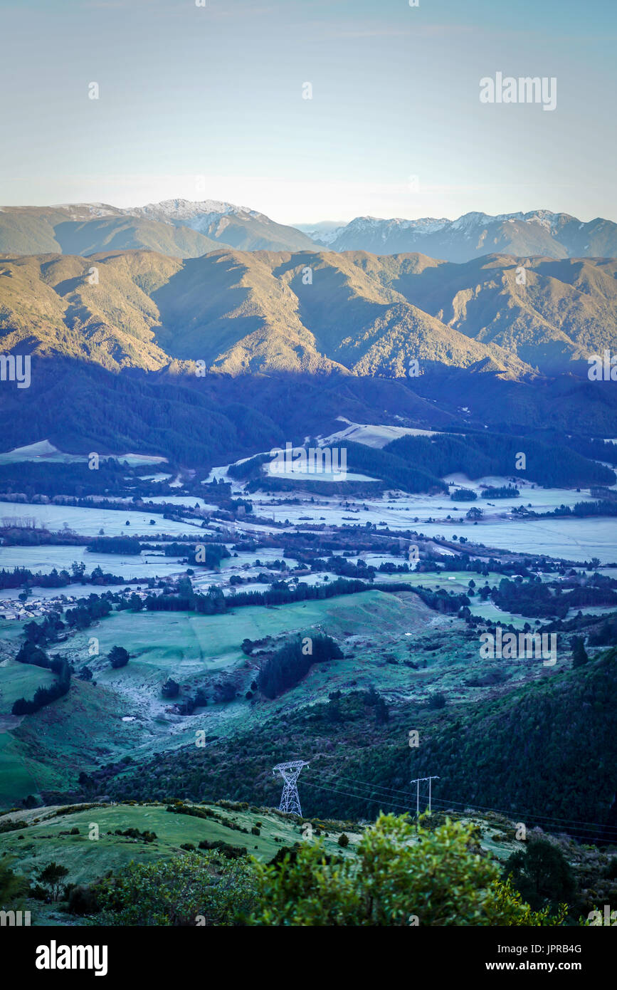 TAKAKA, NEW ZEALAND - Overlooking the stunning mountainscape scenery from Takaka Hill in the winter season of New Zealand. Stock Photo