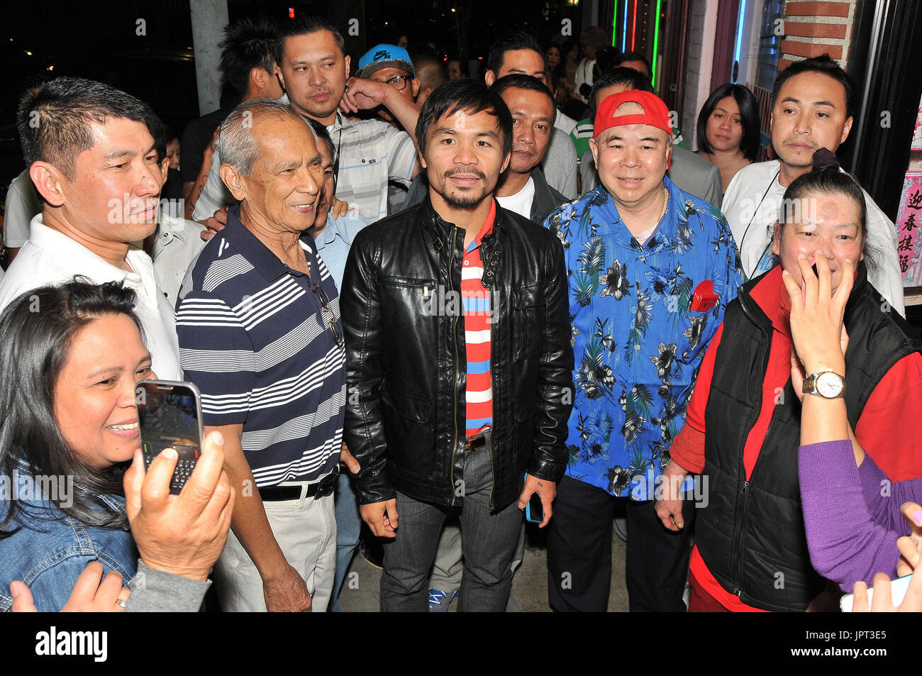 Boxer/Congressman Manny Pacquiao arriving at a birthday celebration at