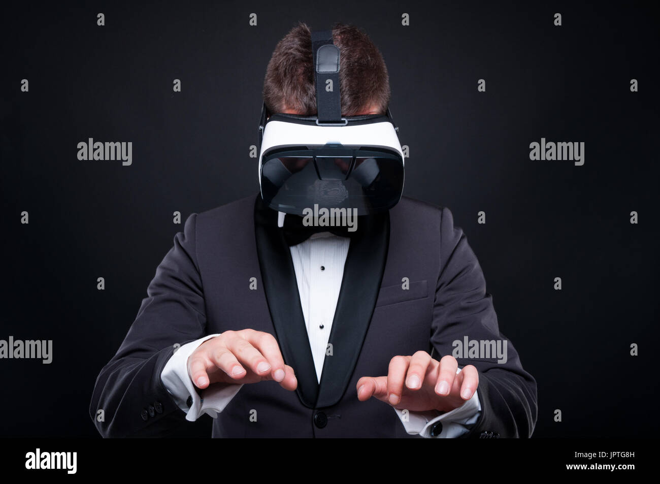 Exclusive man using virtual reality headset and typying on imaginary keyboard Stock Photo