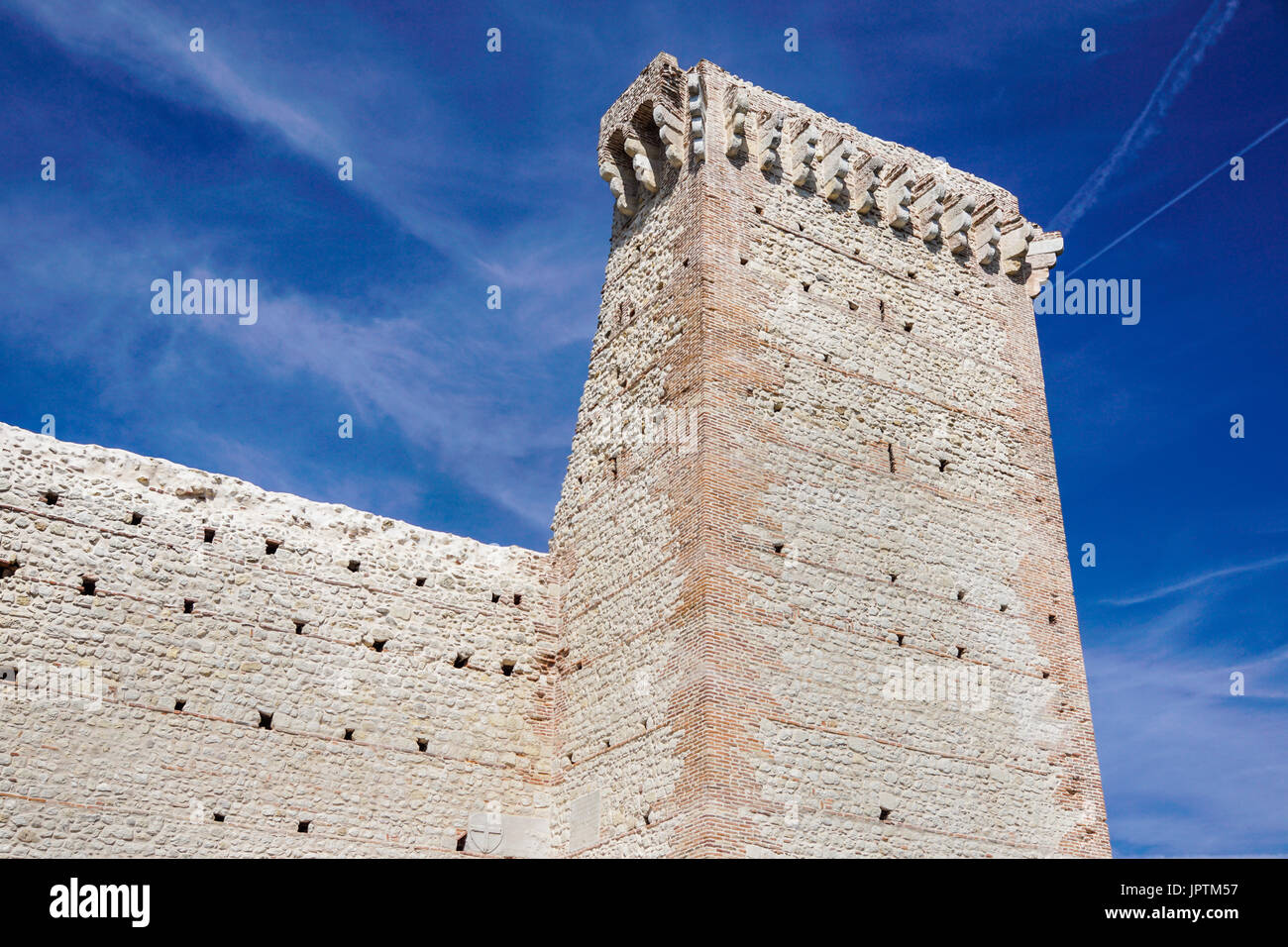 ruins of old medieval castle . fortified wall and tower detail brick ...