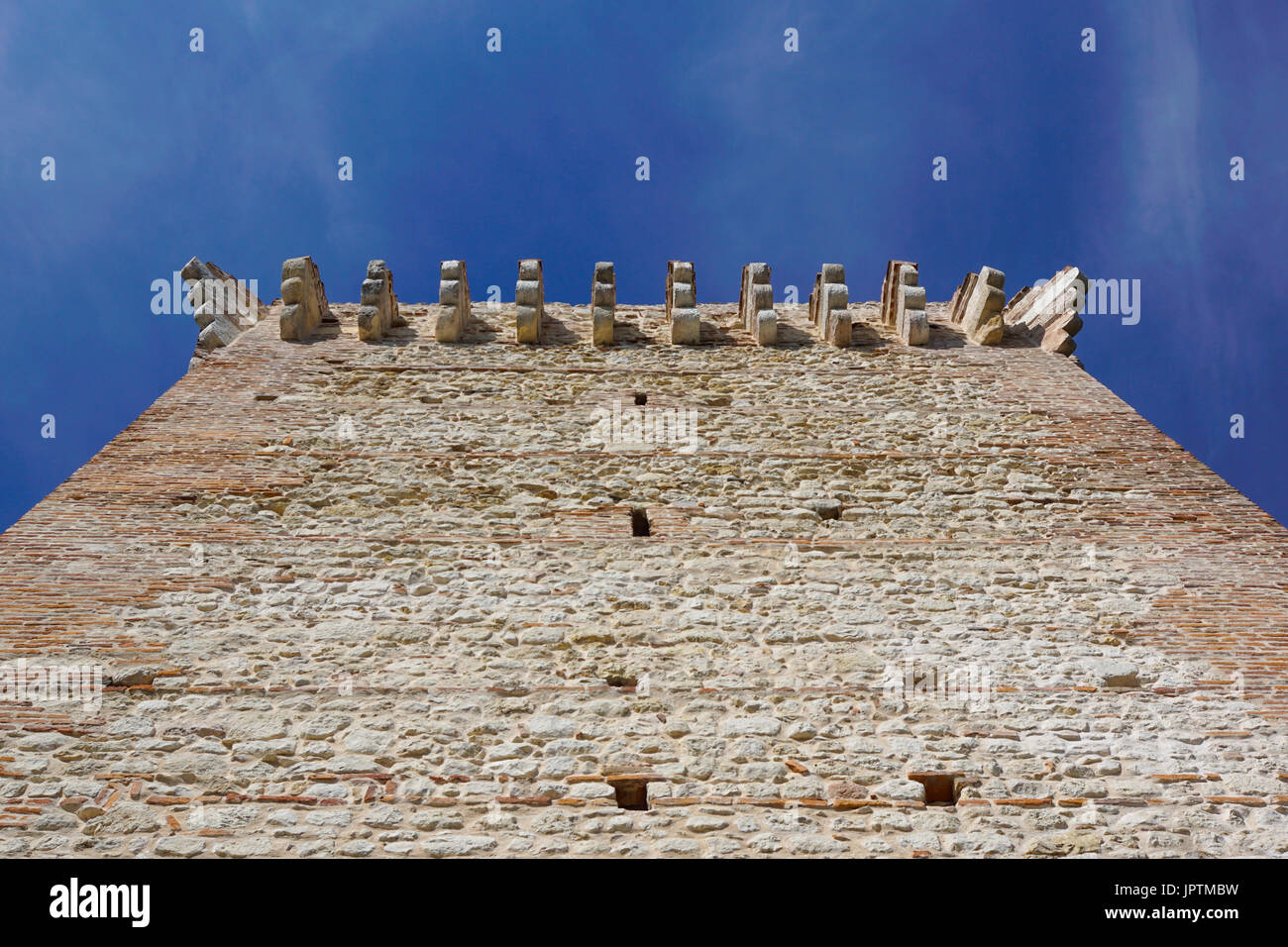 ruins of old medieval castle . fortified wall and tower detail brick ...