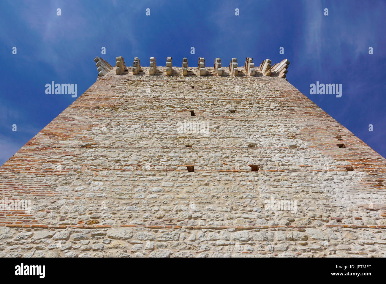 ruins of old medieval castle . fortified wall and tower detail brick ...