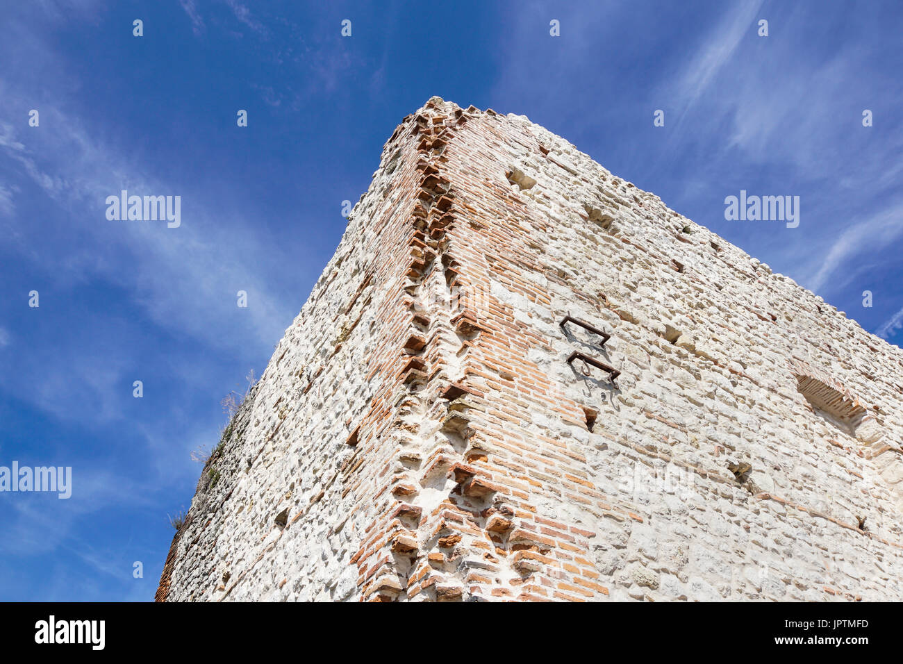 ruins of old medieval castle . fortified wall and tower detail brick ...