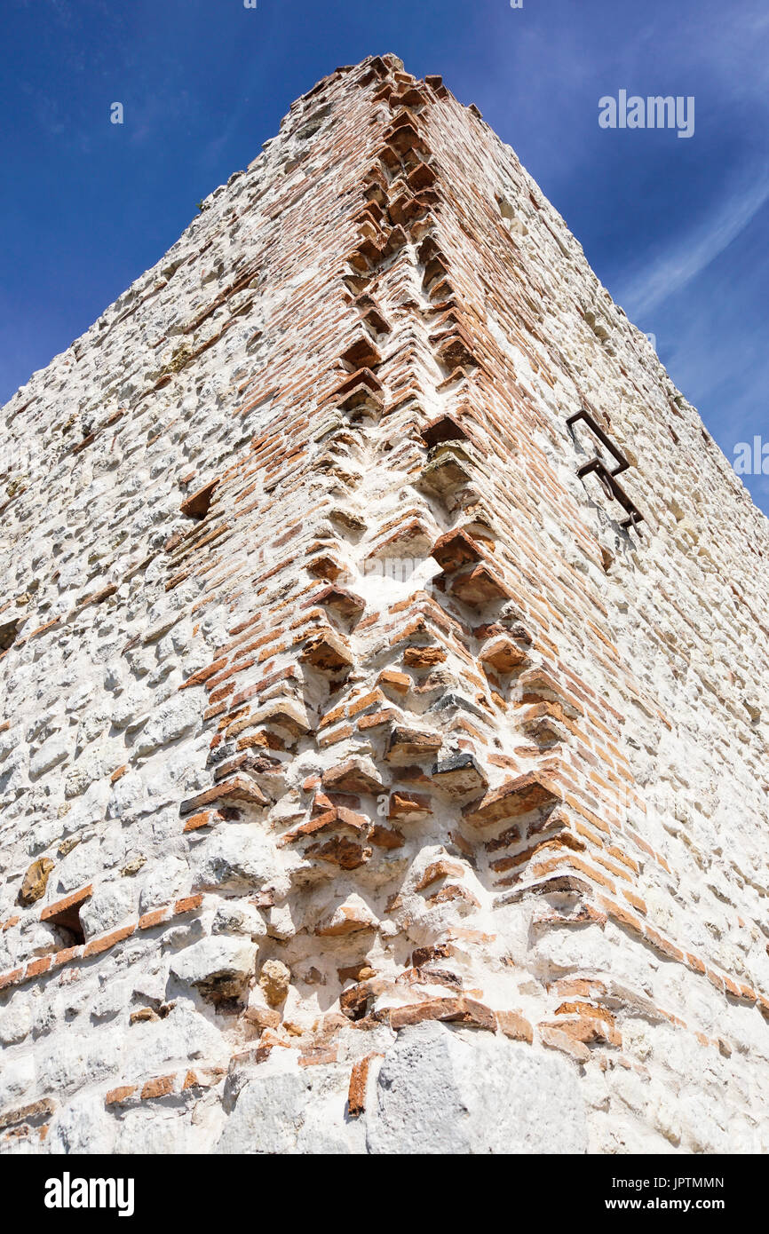 ruins of old medieval castle . fortified wall and tower detail brick ...