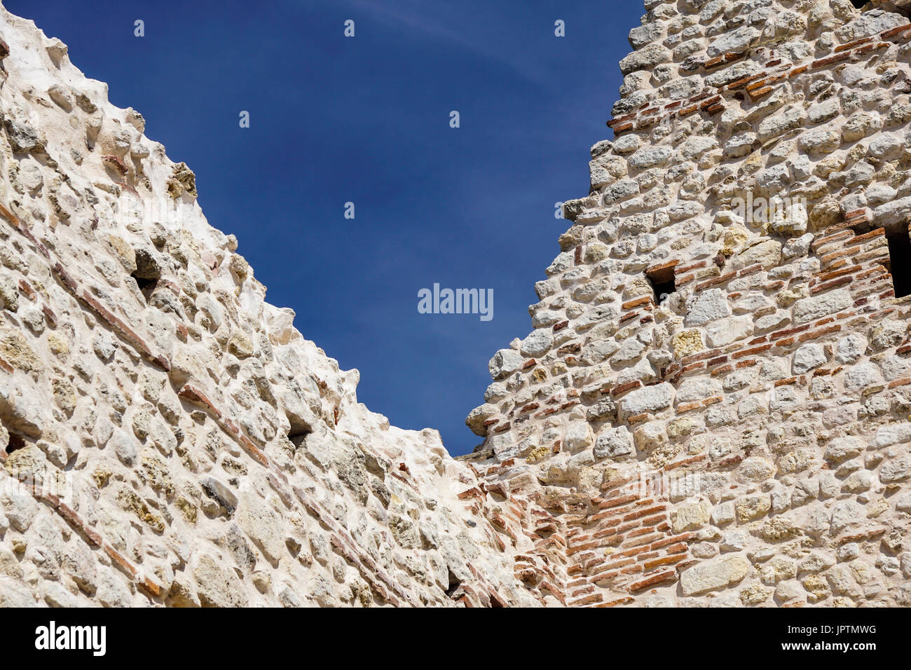 ruins of old medieval castle . fortified wall and tower detail brick ...
