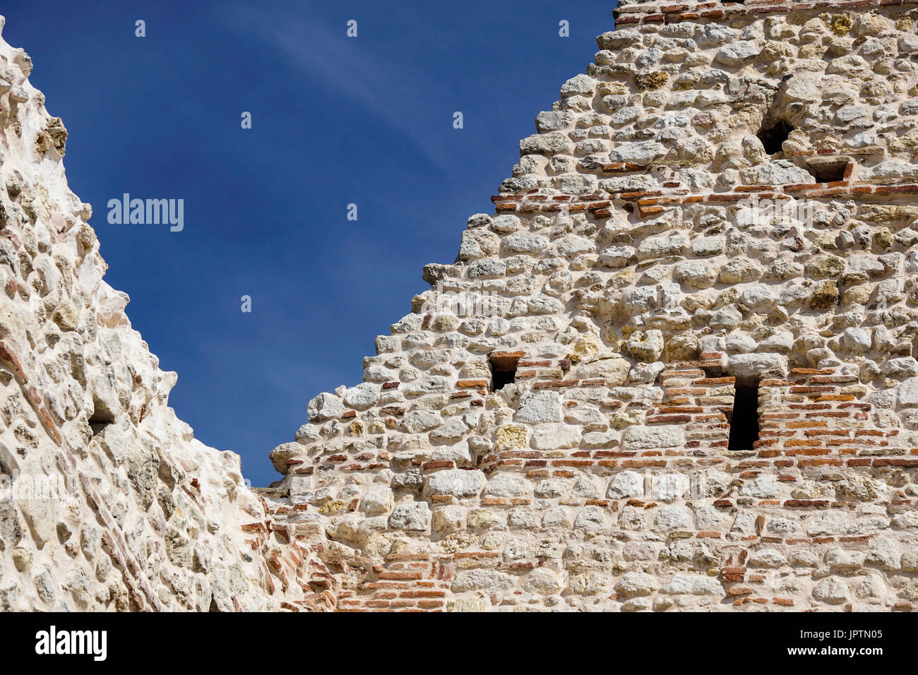 ruins of old medieval castle . fortified wall and tower detail brick ...