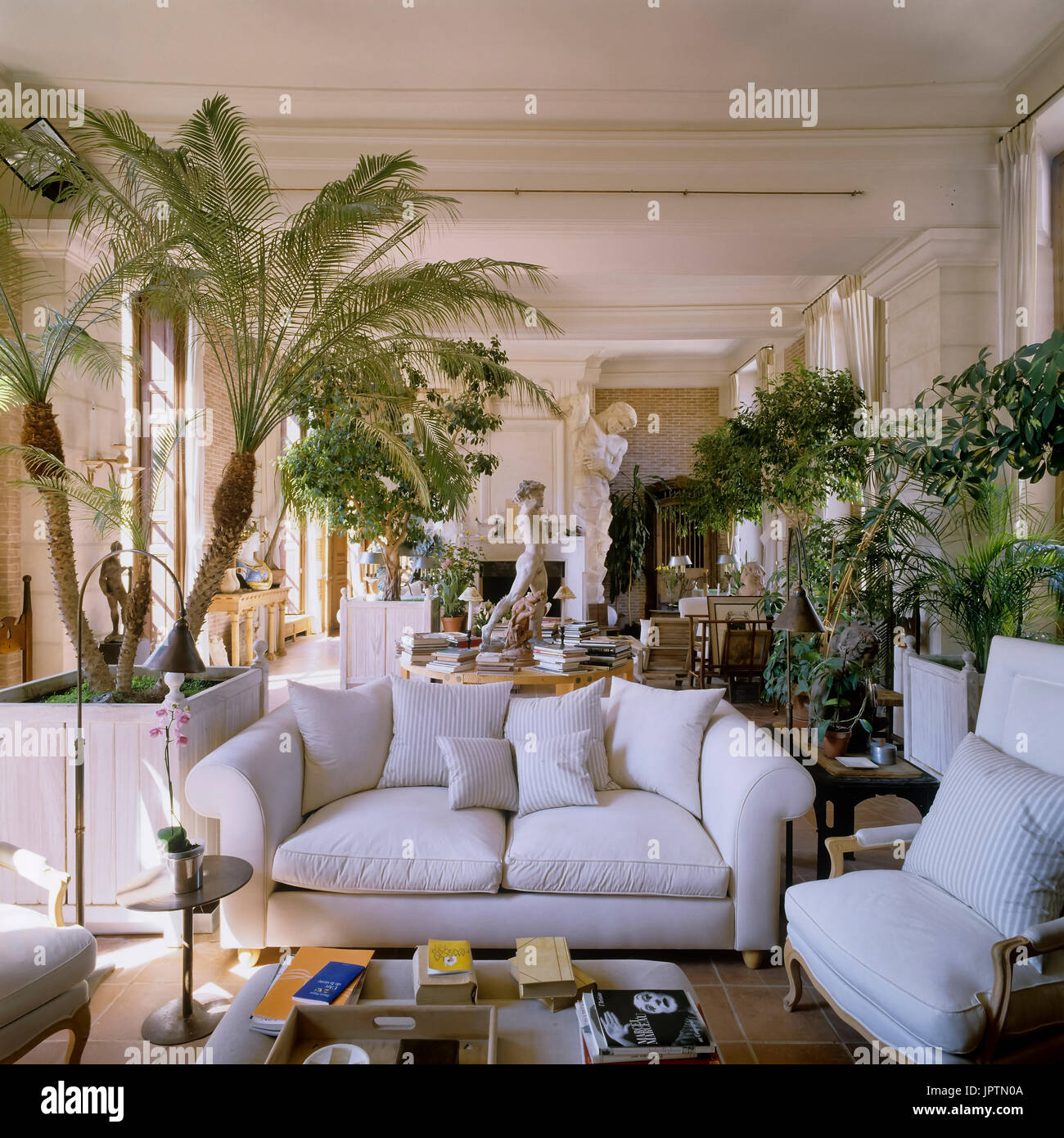 Living room with classical style sculptures Stock Photo Alamy