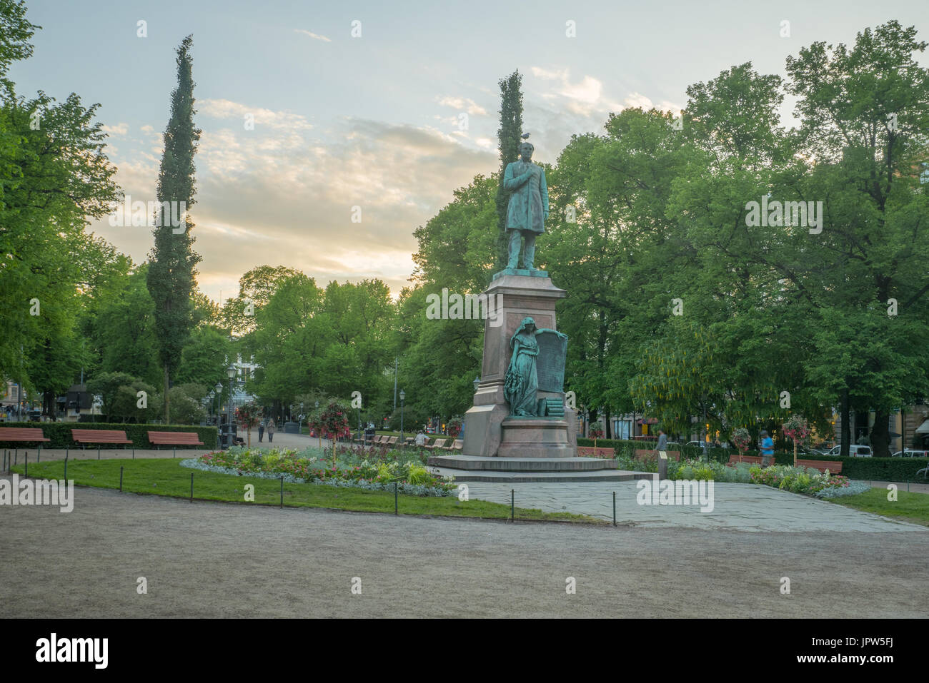 View of the Esplanade Park and the Runeberg Statue, at sunset, in Helsinki, Finland Stock Photo